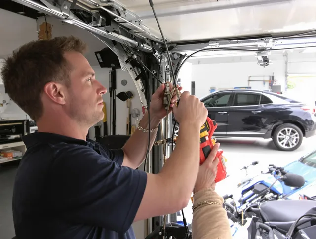 Cleveland Heights Garage Door Repair safety certified technician performing cable replacement in Cleveland Heights
