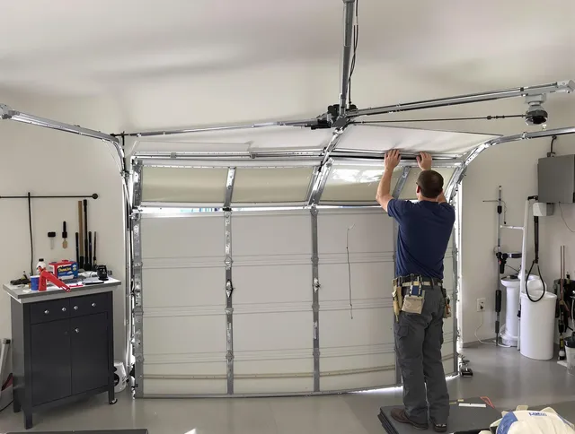Cleveland Heights Garage Door Repair specialist performing precise section replacement on Cleveland Heights garage door